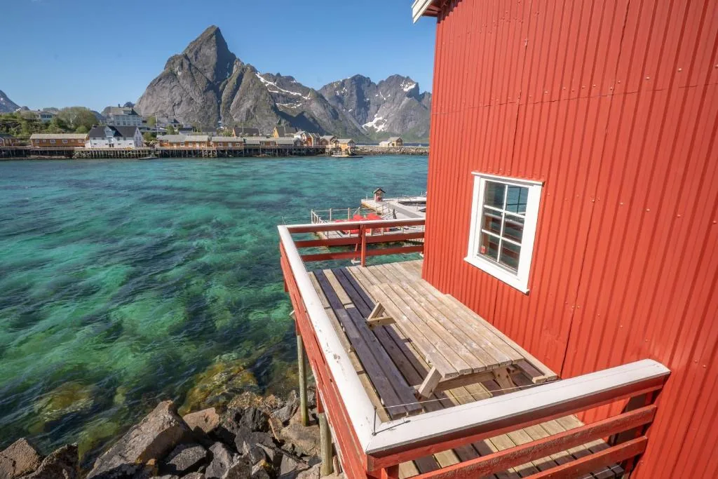 Rostad Retro Rorbuer on Olenilsøya island near Reine, with sea and mountain views over the Lofoten Islands in Norway