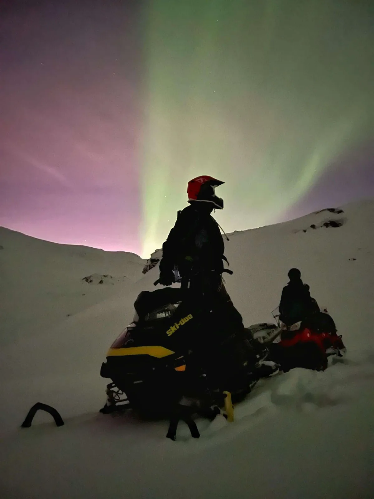 Night snowmobiling under the northern lights in Tromsø with North Experience
