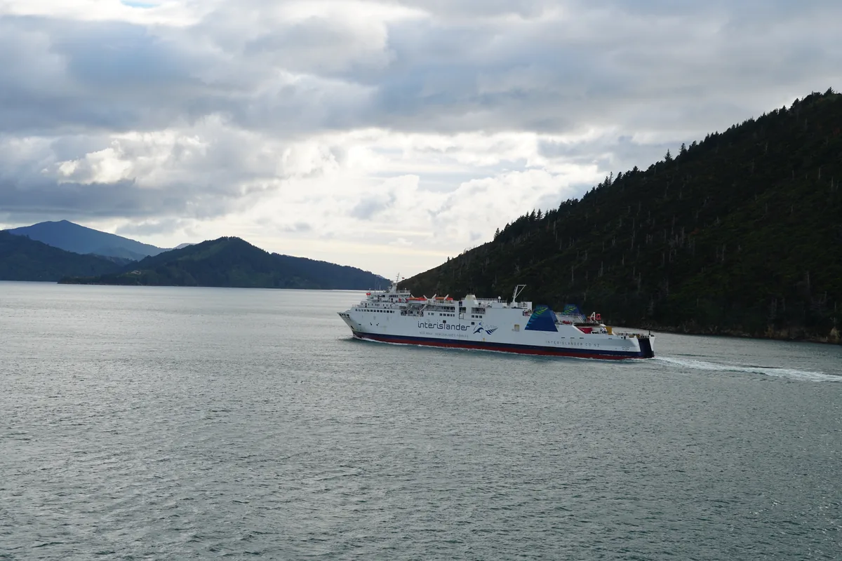 Interislander ferry passed in the middle of the Marlborough Sounds, seen from the Bluebridge, on the Wellington-Picton route.