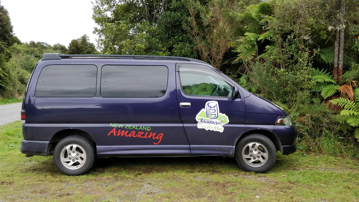 The purple campervan loaded aboard the Bluebridge ferry, during a road trip between the North Island and the South Island.