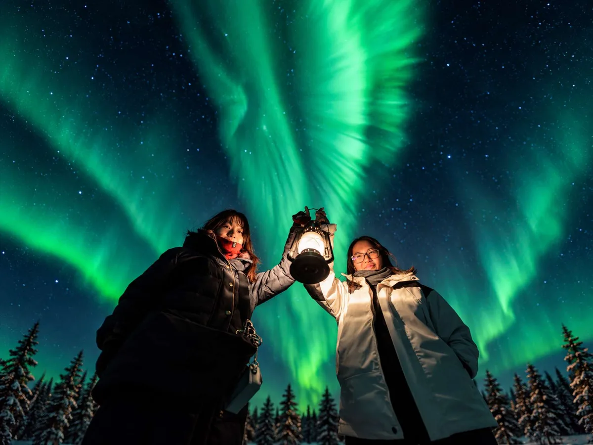 BookLapland northern lights hunt from Rovaniemi: a guide who reads the cloud radar and drives up to 200 km to find clear skies, DSLR photos included, -40°C Arctic suits provided