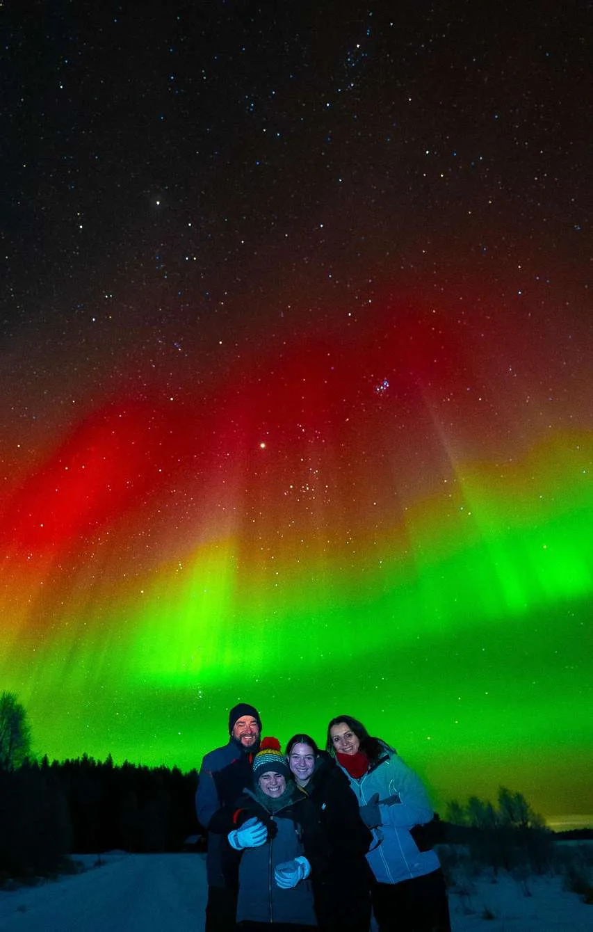 Northern lights hunt with Lapin Taivas Arctic Expeditions in a heated VIP minivan small group in Rovaniemi Finnish Lapland