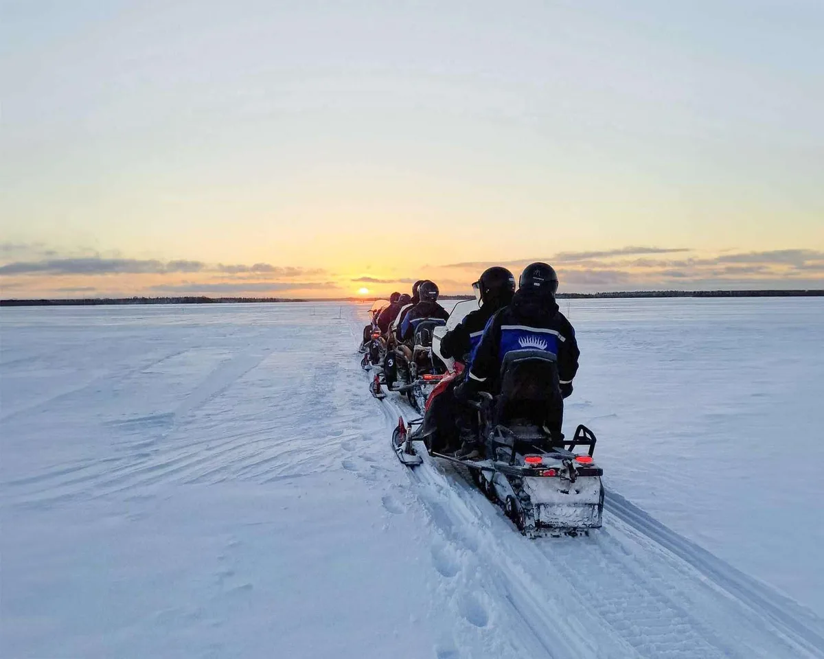 Wilderness snowmobile safari with Apukka Resort through frozen pine forests and frozen marshes in Rovaniemi